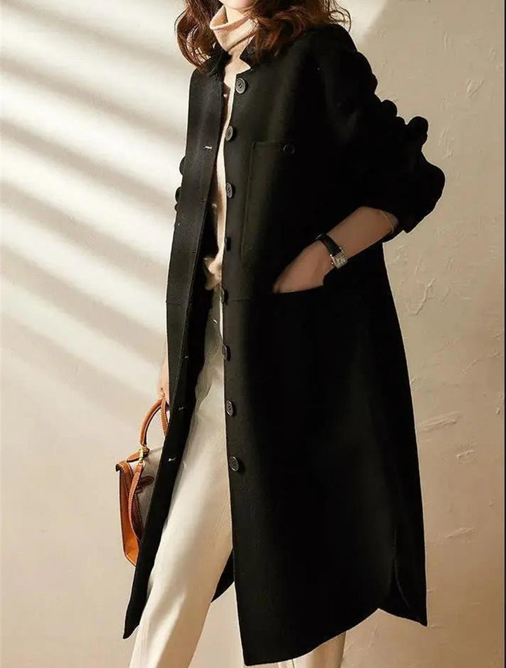 Elegant women's longline trench coat. Versatile outerwear perfect for stylish spring & fall fashion. Available in black/green.