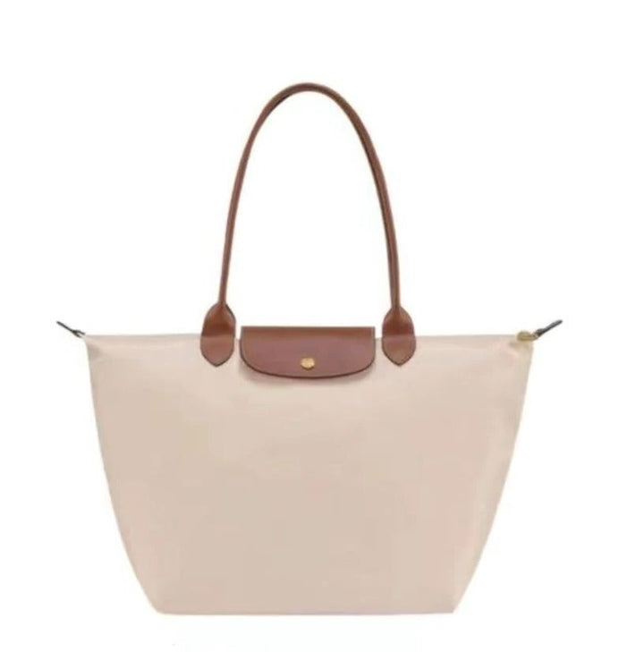 Women's stylish top handle luxury bag. Elegant fashion accessory and practical everyday carry purse.
