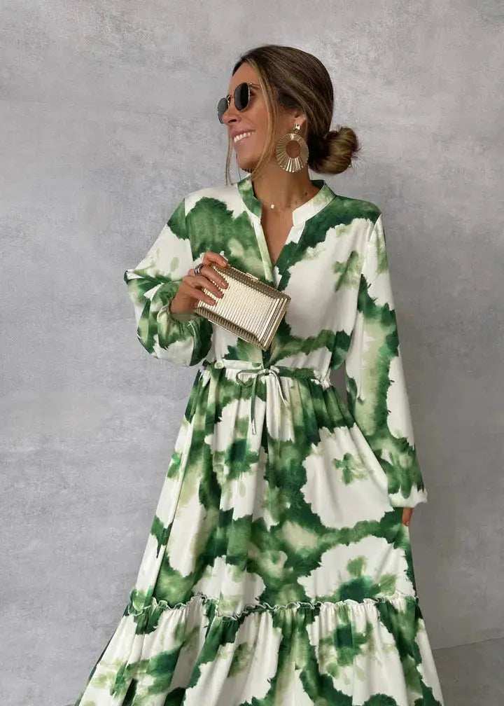 Elegant women's maxi dress with sophisticated puff sleeves, V-neck, and flowy tiered skirt for formal events.