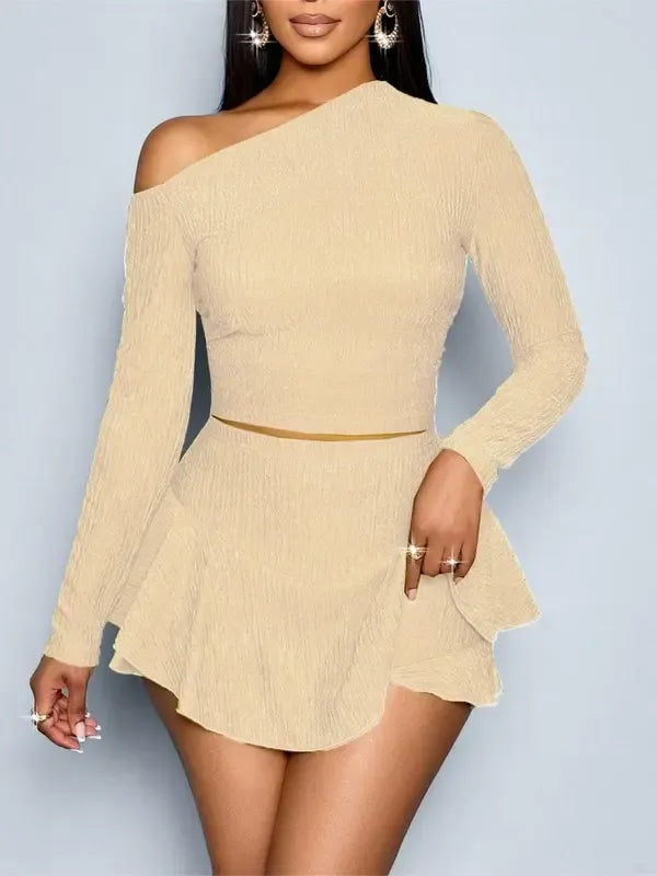 Stylish one-shoulder top & matching mini skirt set for women. An elegant two-piece outfit for summer fashion.
