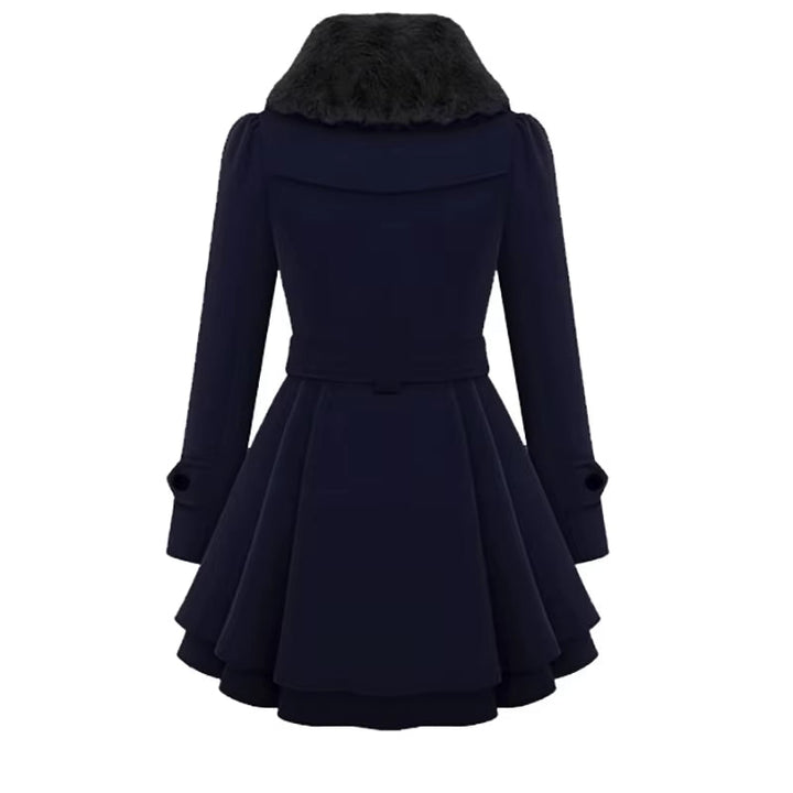 Fashionable women's overcoat showcasing a sophisticated faux fur collar and distinctive layered hem design.