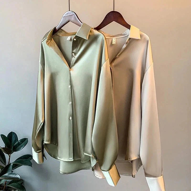 Elegant women's oversized button-down shirt, long sleeve, flowy fabric. Perfect for chic workwear or casual luxury.