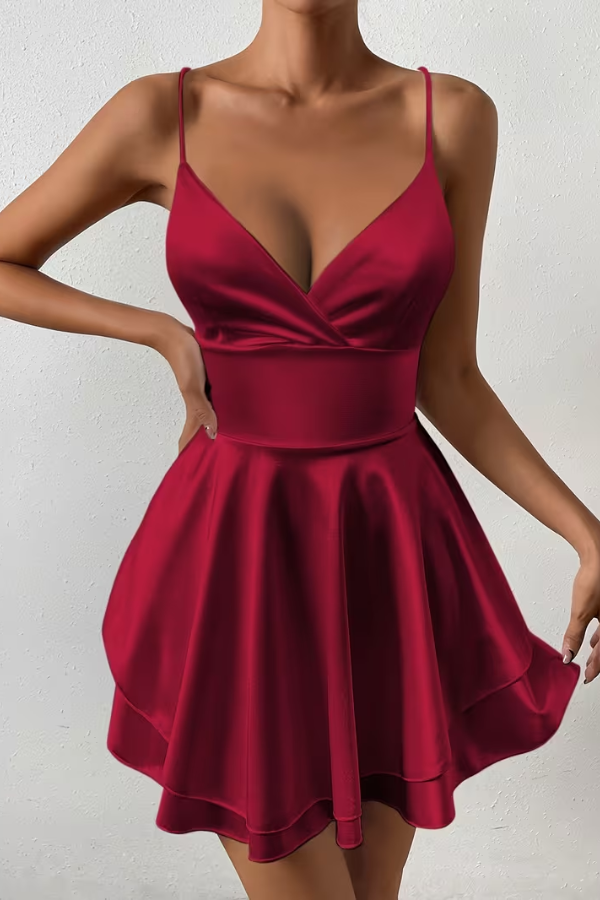 Flowy women's summer swing dress with delicate pleats, V-neck, and chic open back detail.