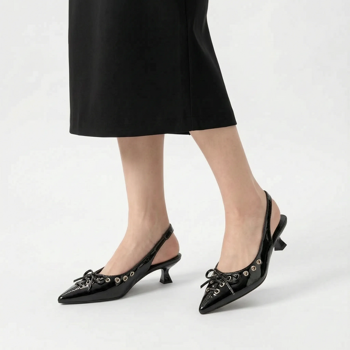 Close-up of elegant pointed toe slingback kitten heels, showcasing the refined design and quality craftsmanship.