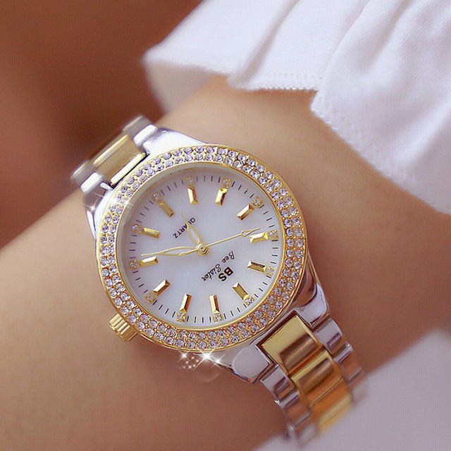 Elegant women's quartz wrist watch with polished stainless steel band, perfect for daily wear & fashion.
