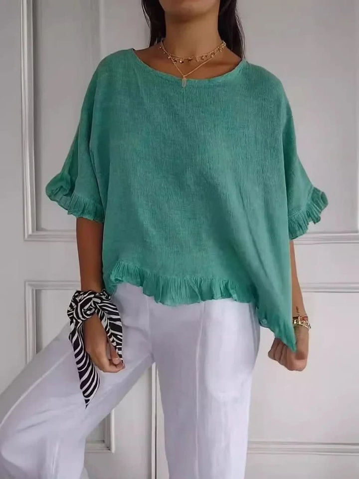 Summer women's elegant ruffle top, breathable and stylish for warm days.