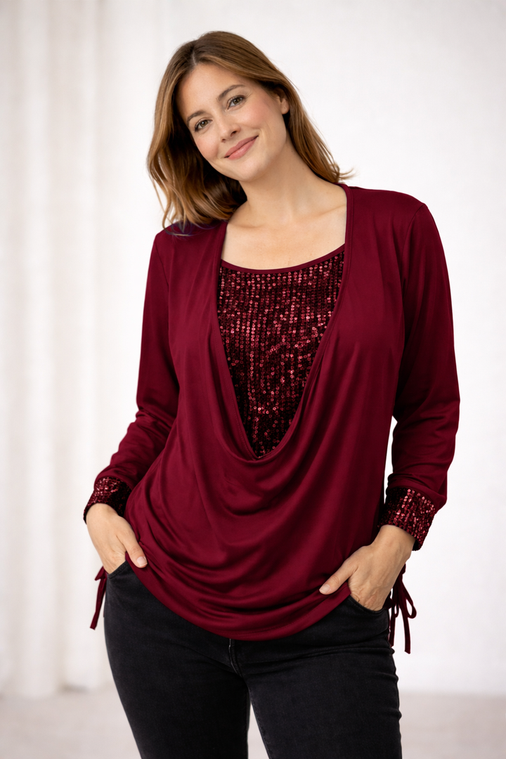 Shimmering sequin blouse for women, featuring elegant long sleeves. A glamorous party top for evening fashion.