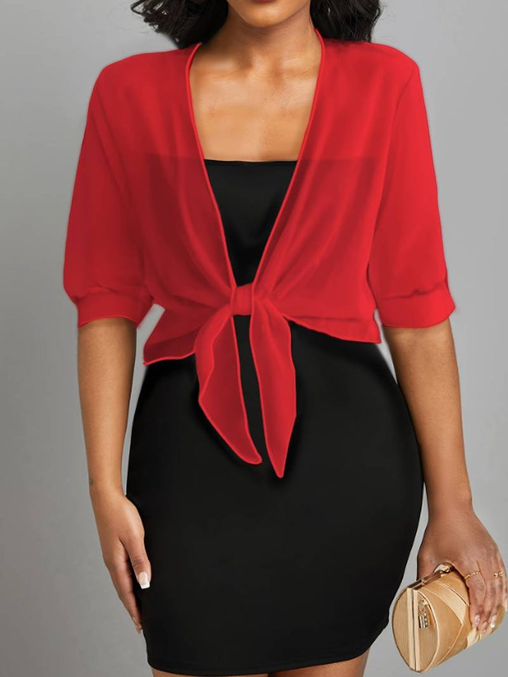 Fashionable women's sheer cropped bolero with tie front and half sleeves, ideal for occasion wear.