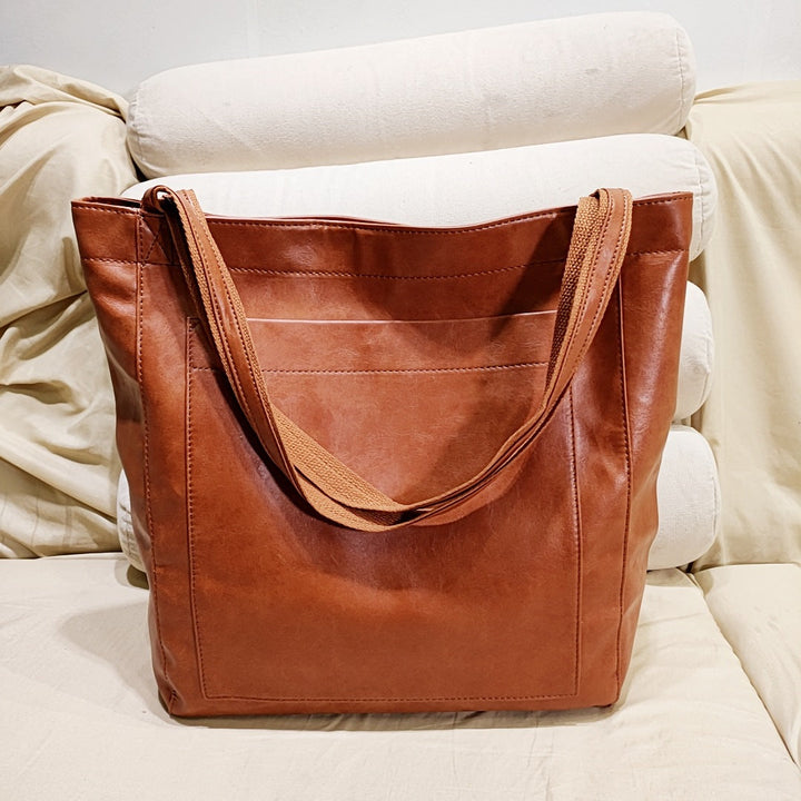Elegant women's structured tote bag in a classic color, perfect for professional use & everyday carry. Chic shoulder & crossbody style.