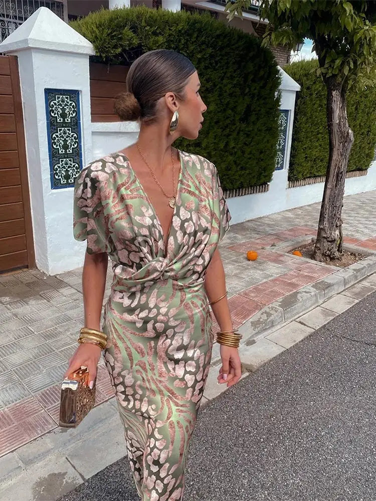 Stunning women's twist front maxi dress, elegant V-neck, flutter sleeves, perfect for special occasions.