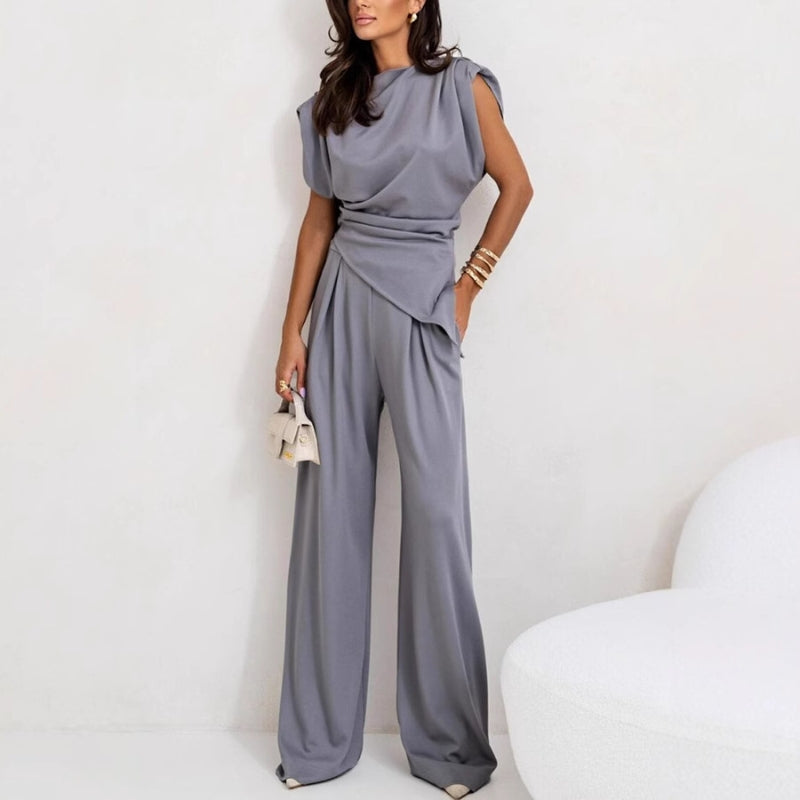 Elegant women's two-piece pants set with sleeveless top, perfect for a modern casual chic outfit.