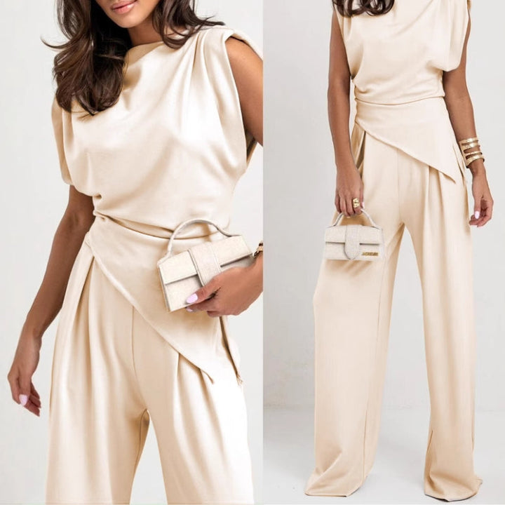 Women's two-piece pants set, an elegant sleeveless top & relaxed fit trousers for a modern style.