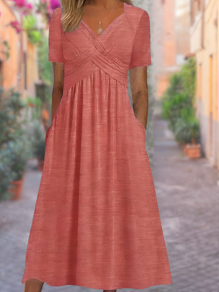 Fashionable women's crisscross V-neck midi dress in a flattering silhouette, suitable for parties.