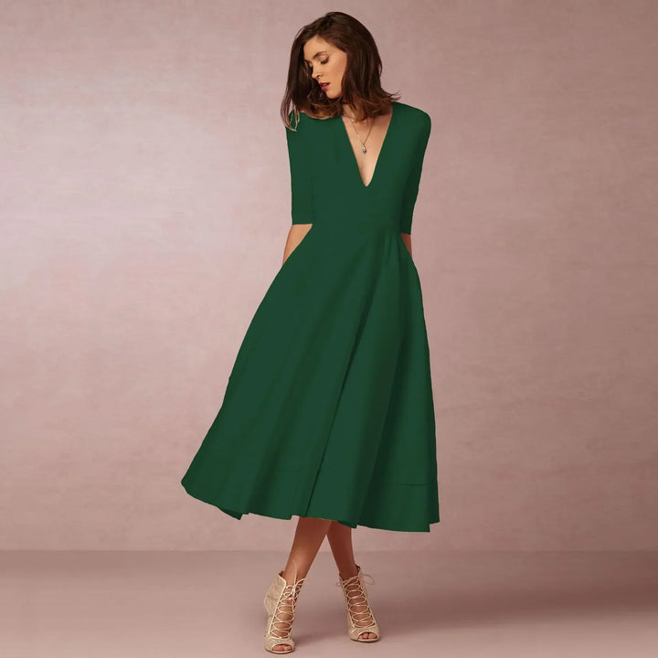 Sophisticated purple V-neck elbow-sleeve midi dress for women, ideal for cocktail parties.