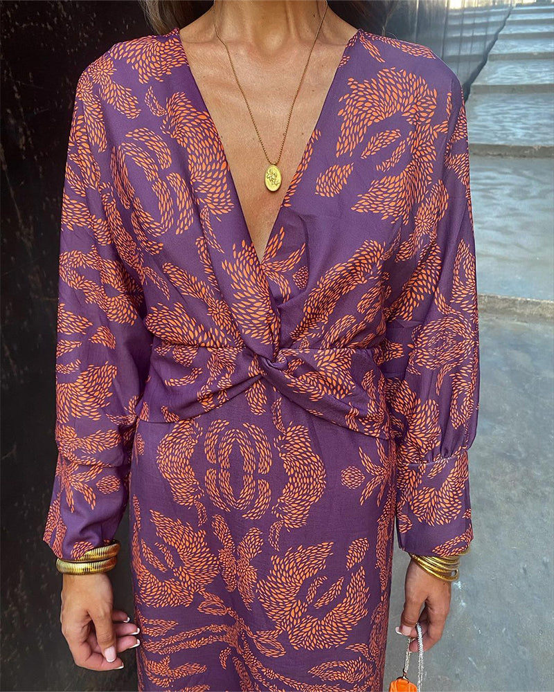 Long sleeve elegant V-neck midi dress for women with a stylish knot detail, perfect for formal occasions.