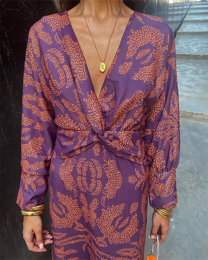 Long sleeve elegant V-neck midi dress for women with a stylish knot detail, perfect for formal occasions.