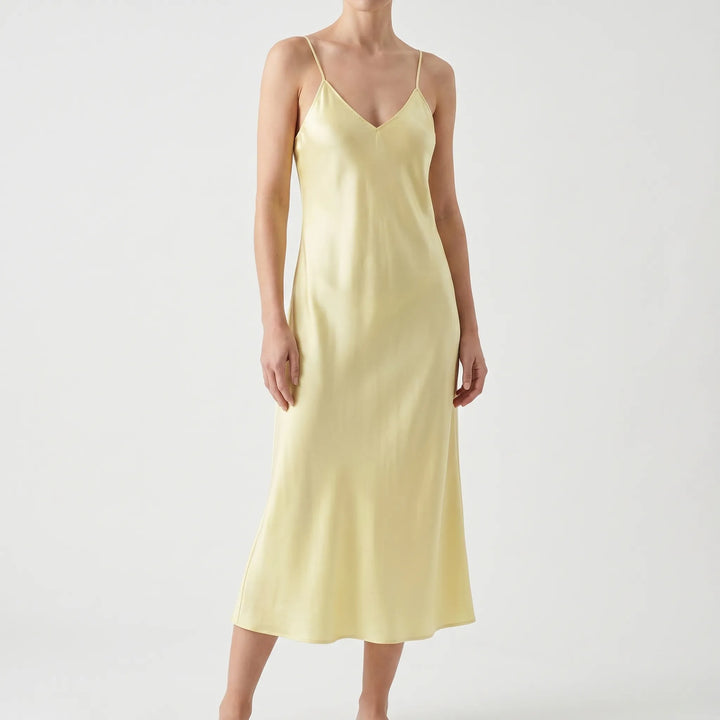 Stylish women's V-neck spaghetti strap slip dress, a versatile midi for casual comfort or party elegance.