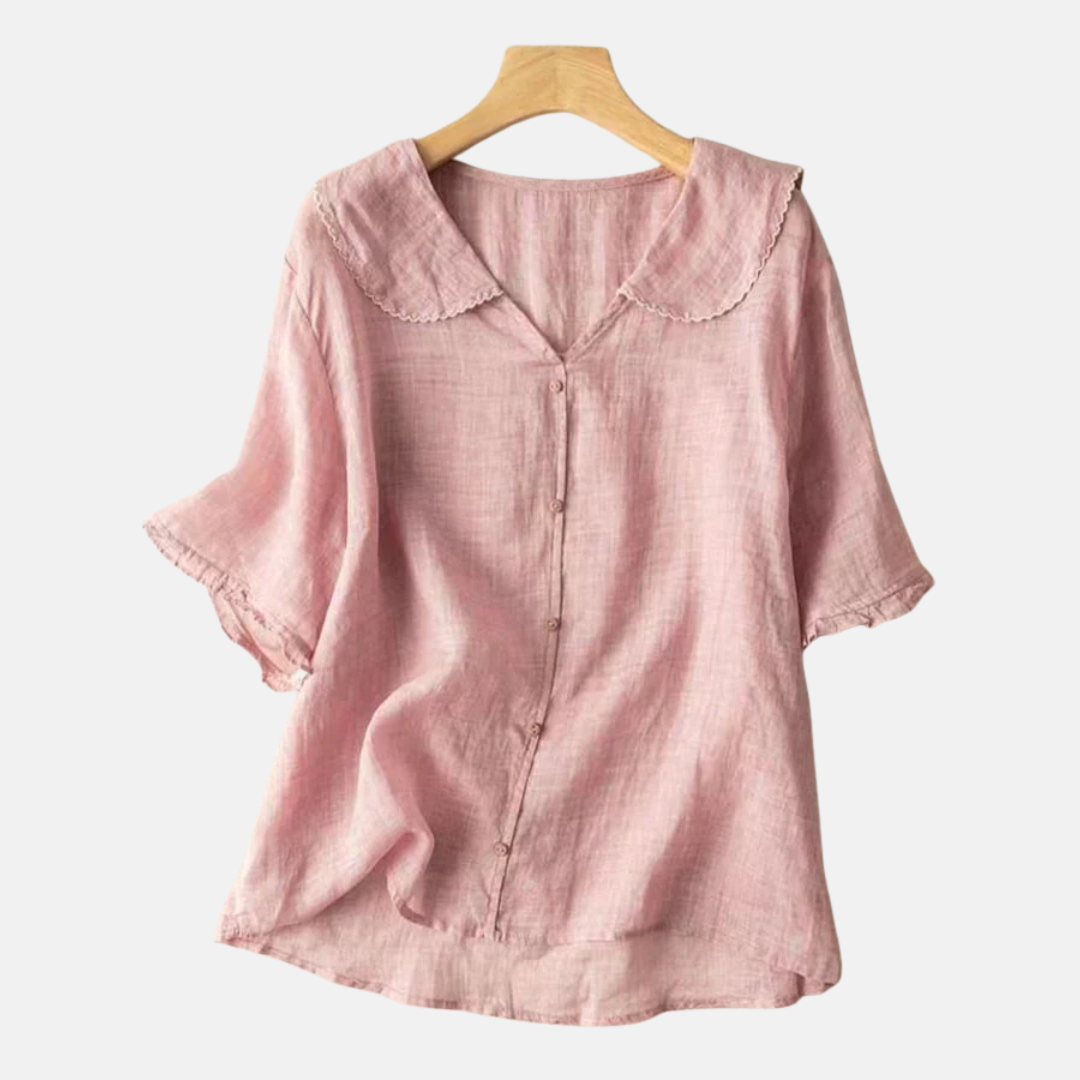 Women's elegant short sleeve blouse featuring a charming vintage doll collar. Comfortable and stylish summer top.