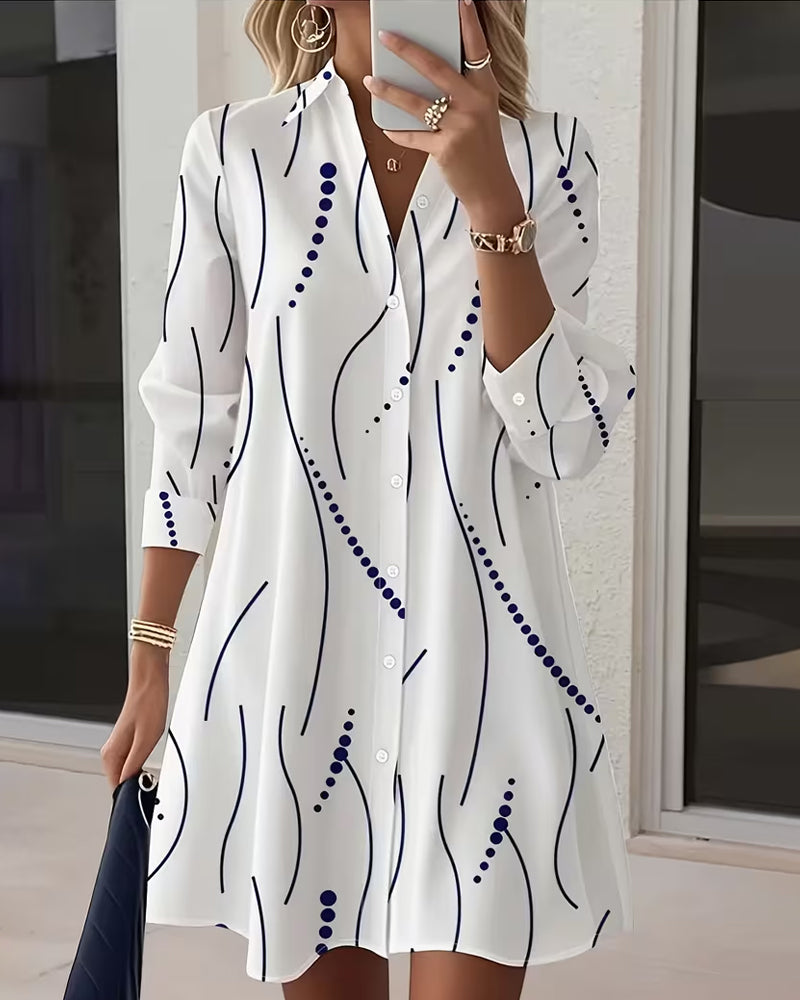 Women's flowy midi dress with a stylish wavy collar & leafy print, perfect for casual chic everyday wear.