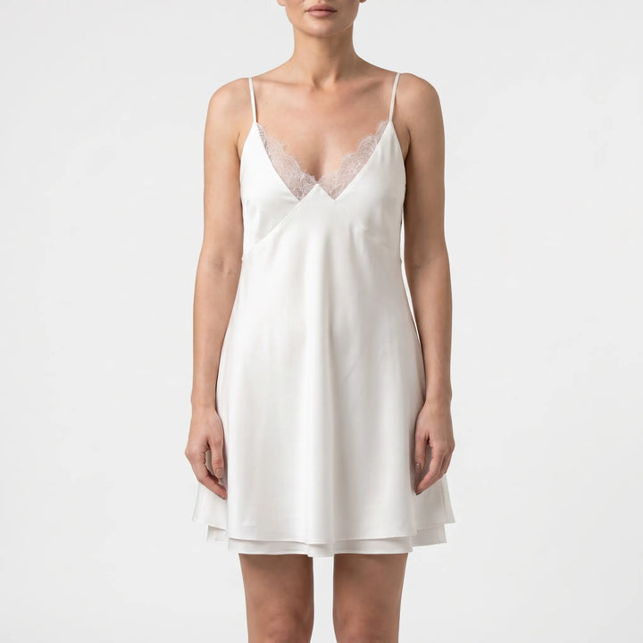 Stylish white backless mini dress for women. Ideal for summer parties, elegant evening events, or casual wear.