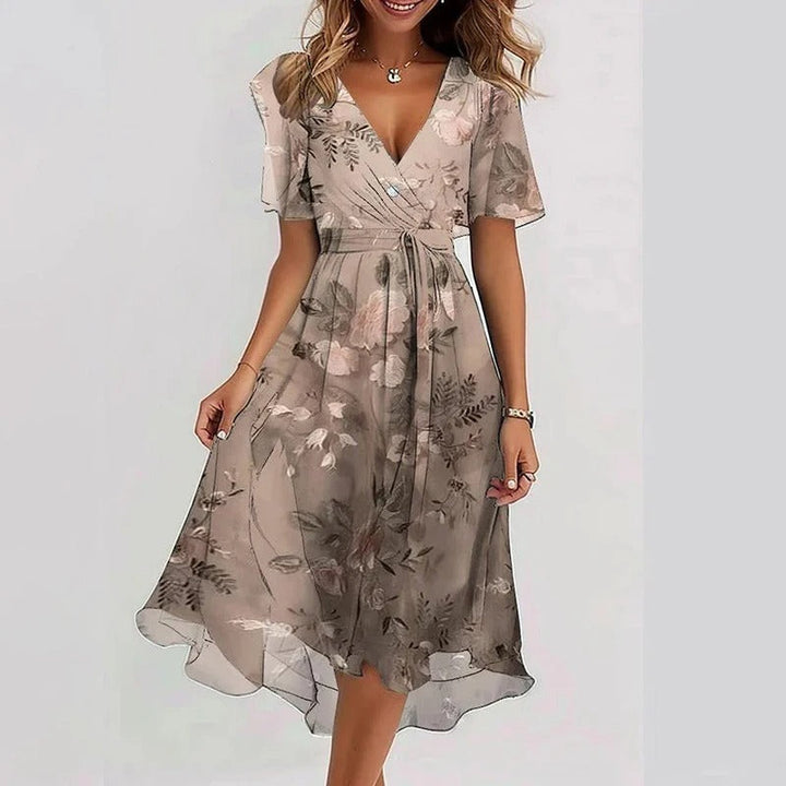 Women's midi wrap dress with V-neck, flutter sleeves & a flowing silhouette, versatile for any occasion.