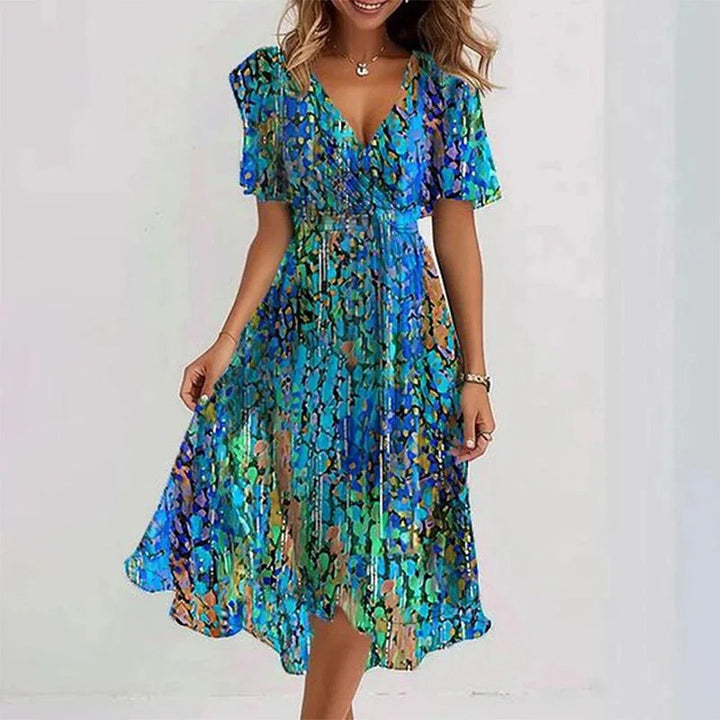 Lightweight women's floral midi wrap dress with V-neck & flutter sleeves, perfect for a casual summer feel.