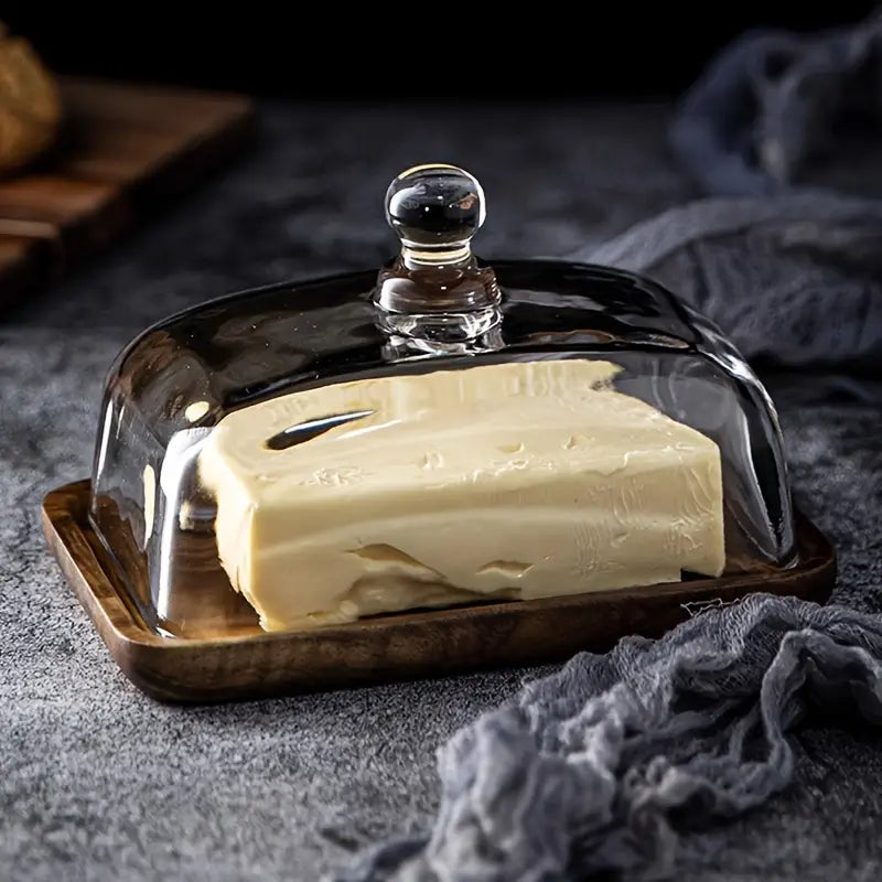 Stylish acacia wood base with clear glass lid butter dish, ideal for serving fresh butter.