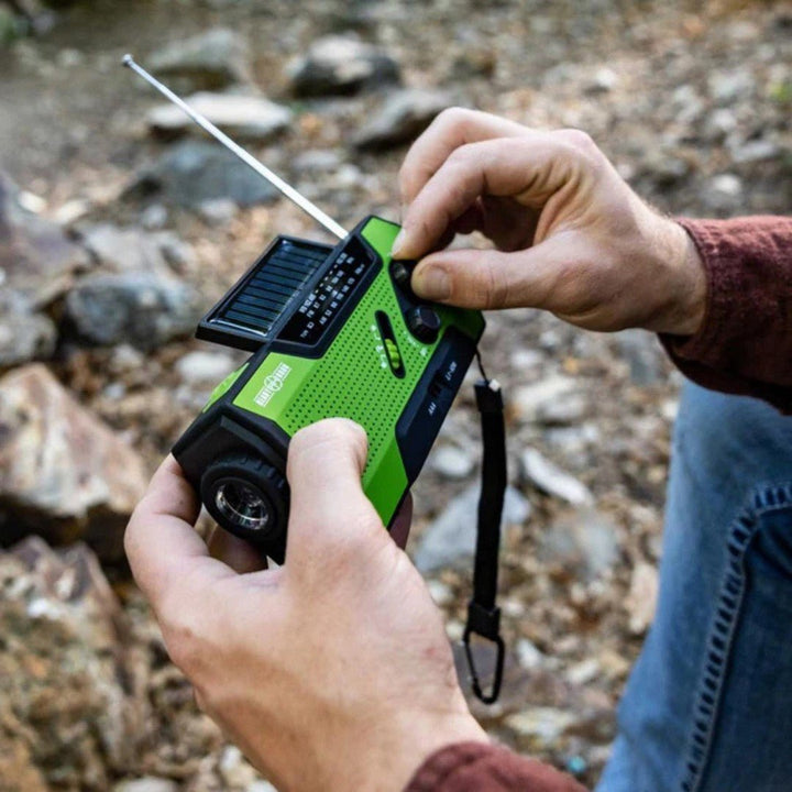 Outdoor essentials: red emergency radio with solar charging, hand crank, and 4000mAh power bank