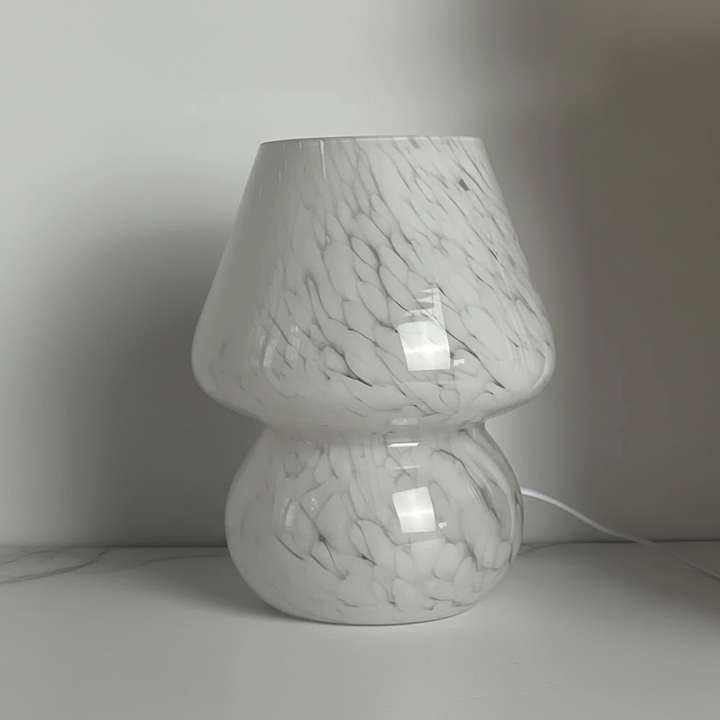 Artistic glass mushroom lamp, a charming home decor piece with soft, cozy lighting.