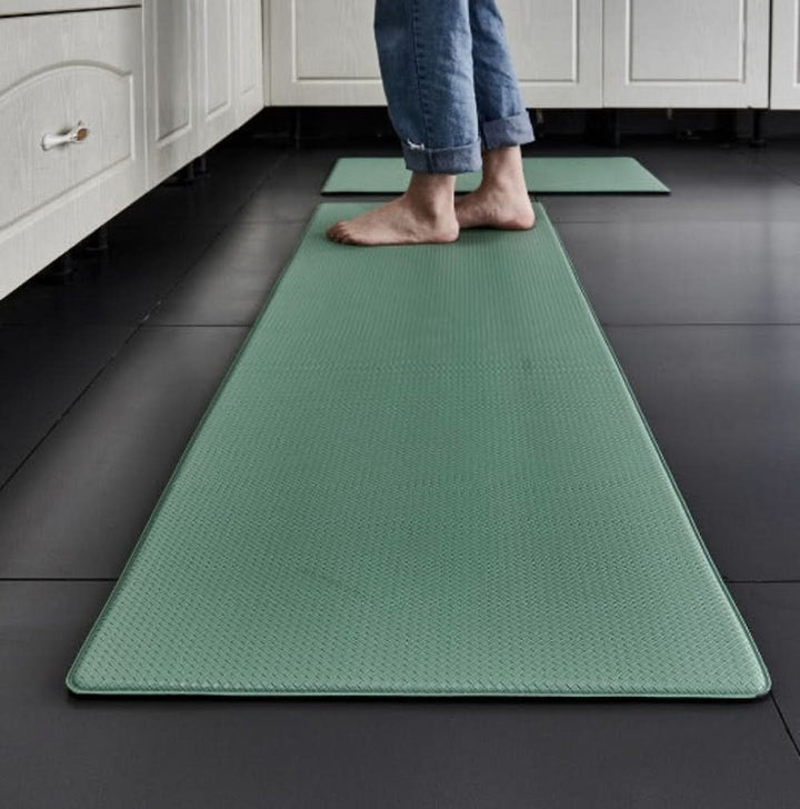 Thick anti-fatigue kitchen floor mat providing cushioned standing comfort, support & pain relief. Non-slip design.