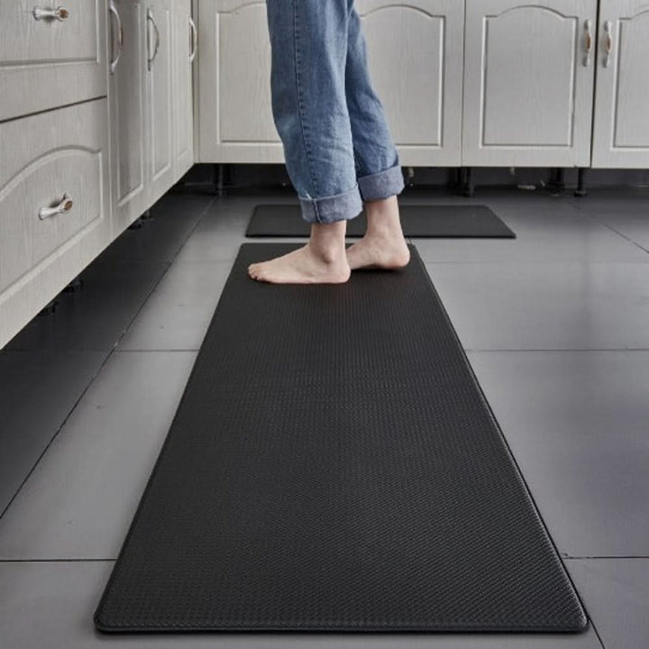 Stylish ergonomic kitchen mat with non-slip bottom, perfect for home kitchens. Easy-clean indoor floor protection.