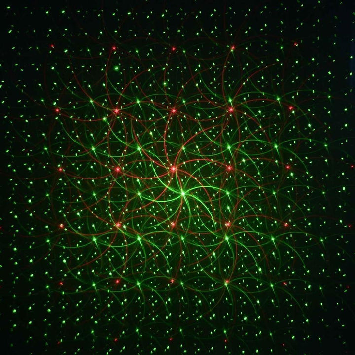 Versatile outdoor laser projector for seasonal & holiday decor, casting vibrant red & green lights on homes.