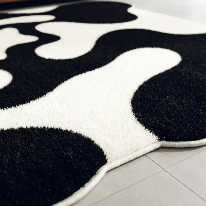 Modern abstract wavy pattern area rug. Flowique contemporary floor accent rug for living room or bedroom decor.