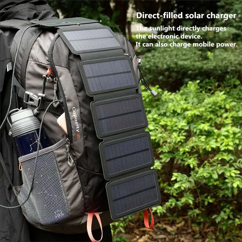 Foldable 28W USB solar panel charger for outdoor adventures, compact camping power supply.