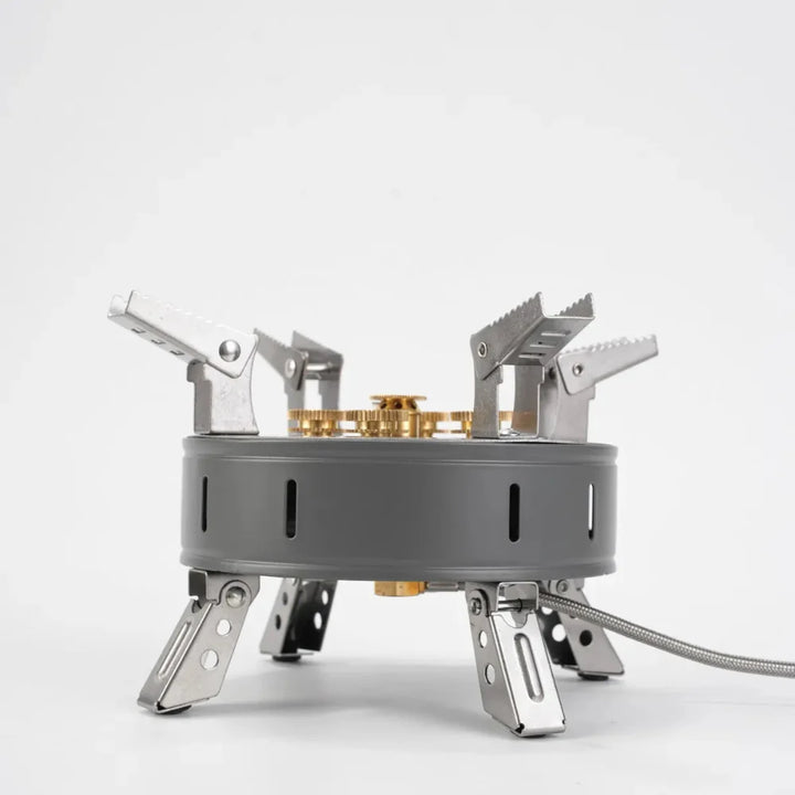 Portable camping stove, showing its sturdy construction and gas connection for cooking.