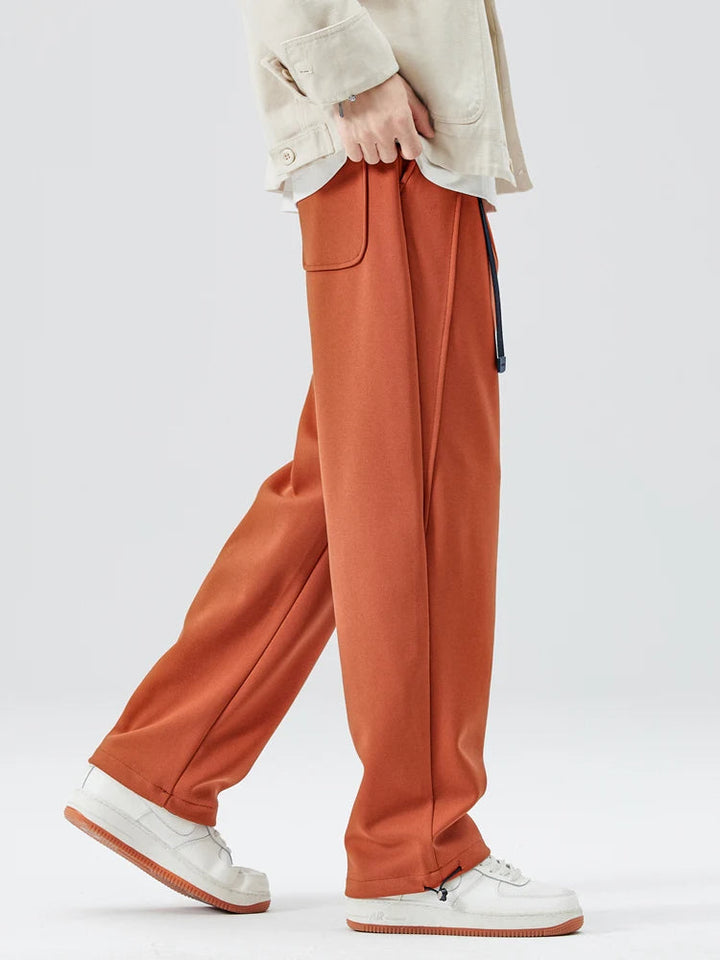Back view of comfortable men's wide-leg trousers, ideal for a smart casual or relaxed look.