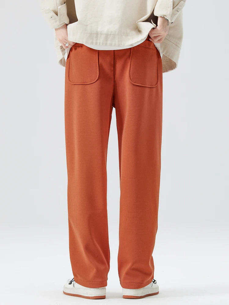 Side profile of men's modern wide-leg trousers, showcasing the relaxed fit and contemporary style.