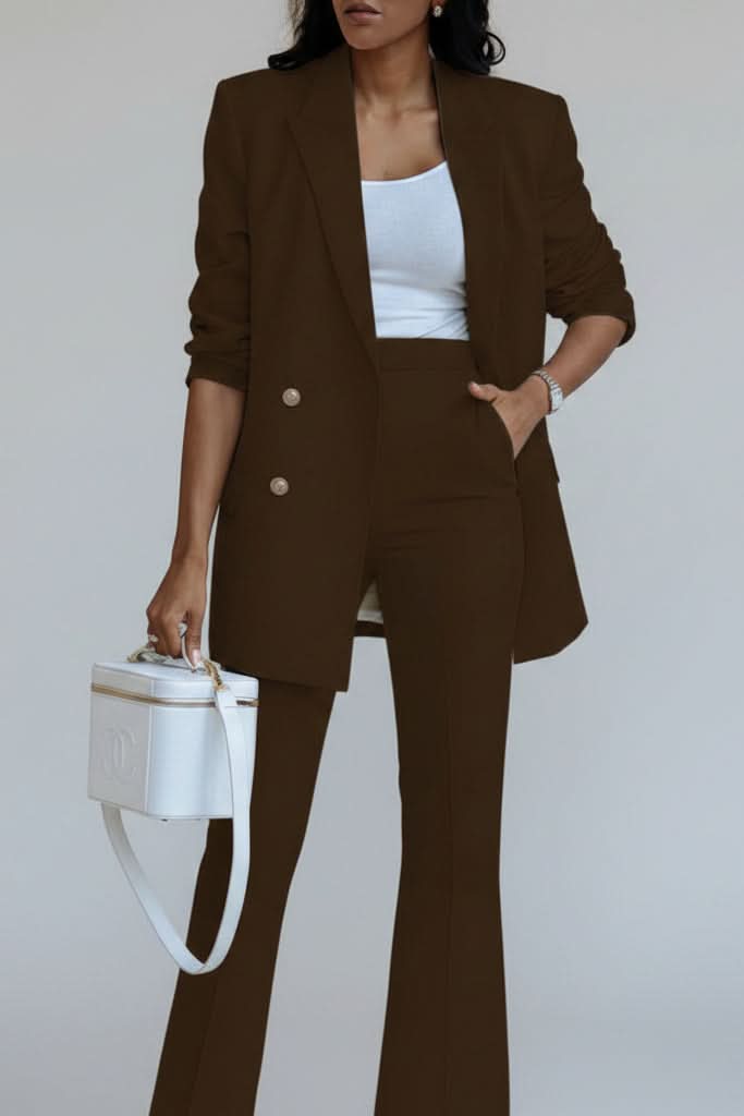 Back view of a refined women's formal wear blazer suit, showcasing its tailored fit.