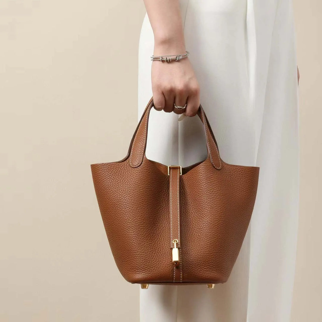Red genuine leather bucket bag, elegant women's designer quality everyday bag.