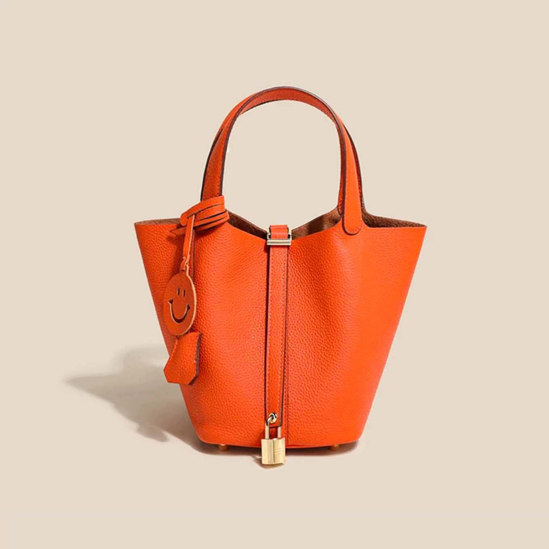 Brown genuine leather bucket bag, classic women's elegant shoulder handbag.