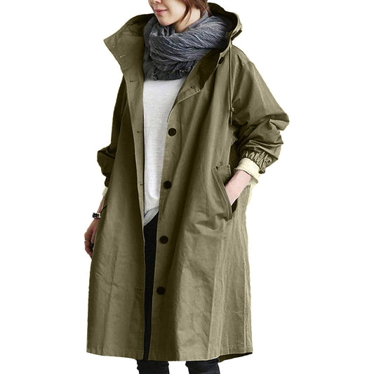 "Giacca impermeabile donna con cappuccio elegante, tessuto blu, design moderno monopetto, perfetta per pioggia e vento."