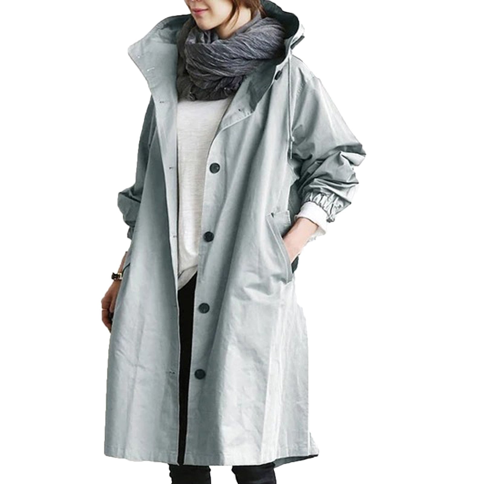 "Giacca impermeabile donna con cappuccio elegante, tessuto blu, design moderno monopetto, perfetta per pioggia e vento."