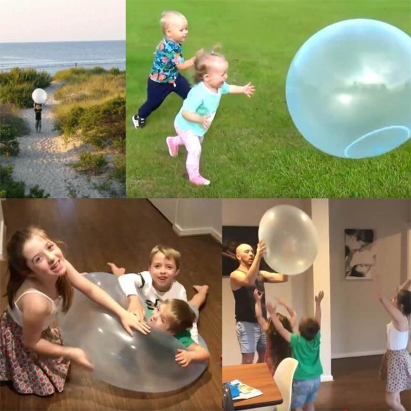 Active outdoor fun with a large transparent bubble ball for children.