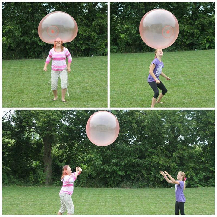 Group of kids enjoying a huge bubble ball, a fun outdoor party toy.