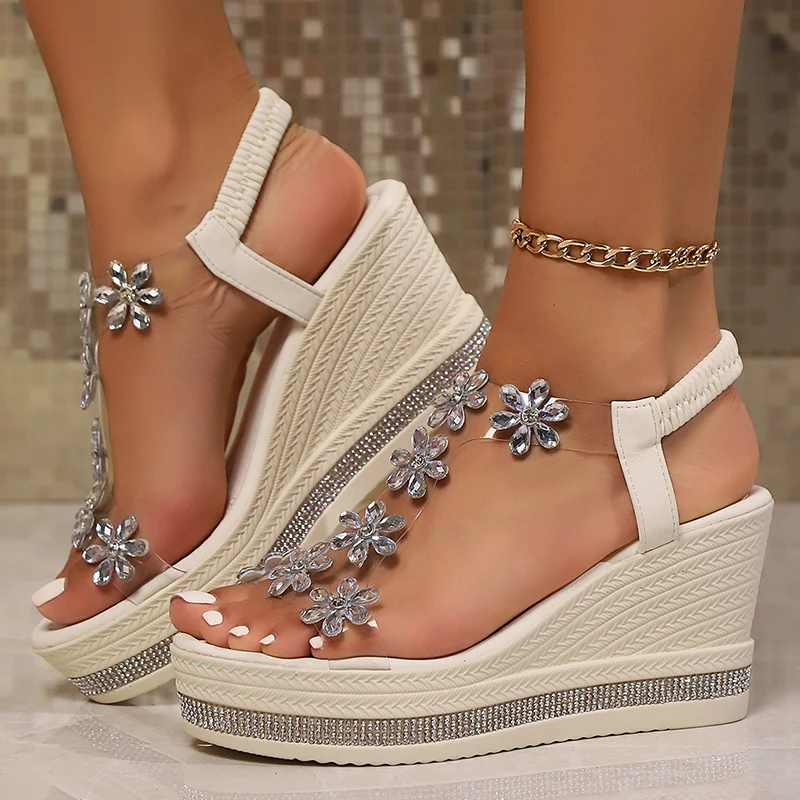 Shimmering crystal-embellished women's platform wedge heels, ideal evening & party footwear with clear strap.