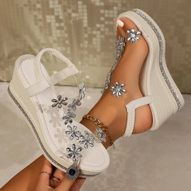 Dazzling women's rhinestone platform wedge heels, clear strap adds modern touch to glamorous party footwear.