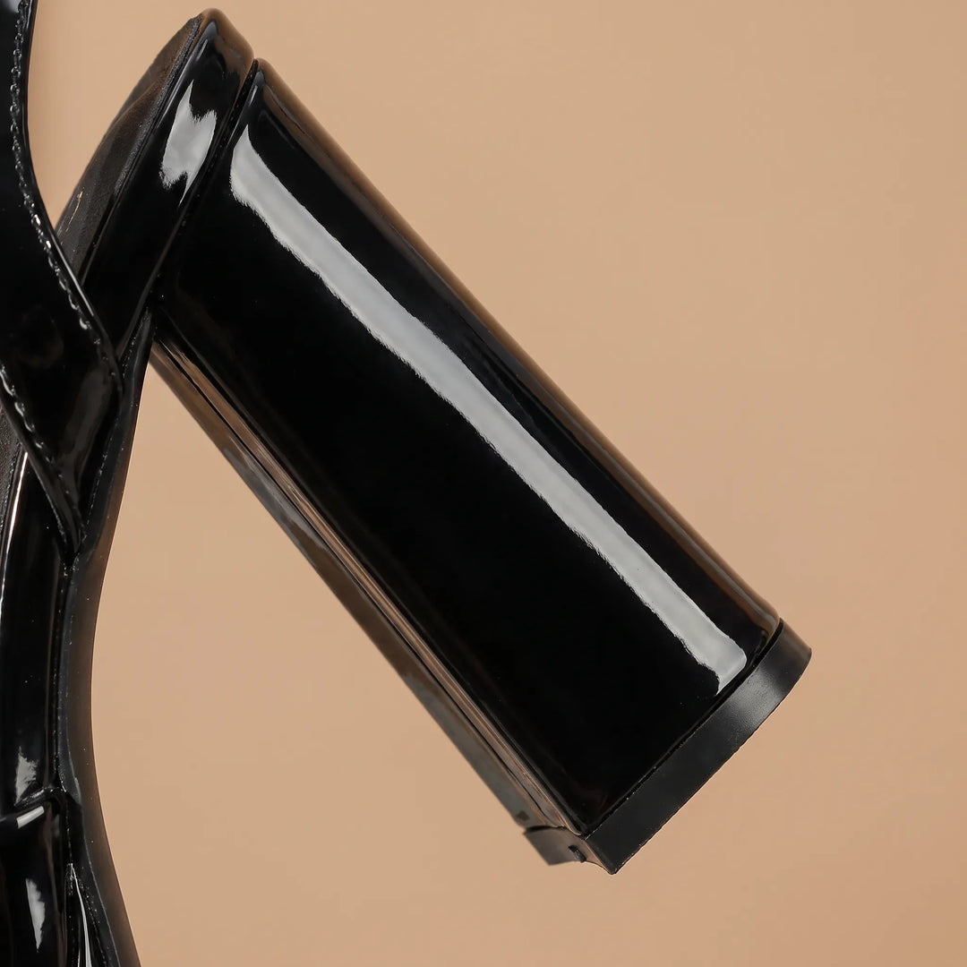 Statement women's chunky platform sandals in glossy black, ideal fashion footwear for evening events.