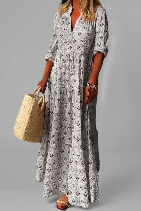 Women's green tiered maxi dress, featuring a graceful, flowing design for summer elegance.