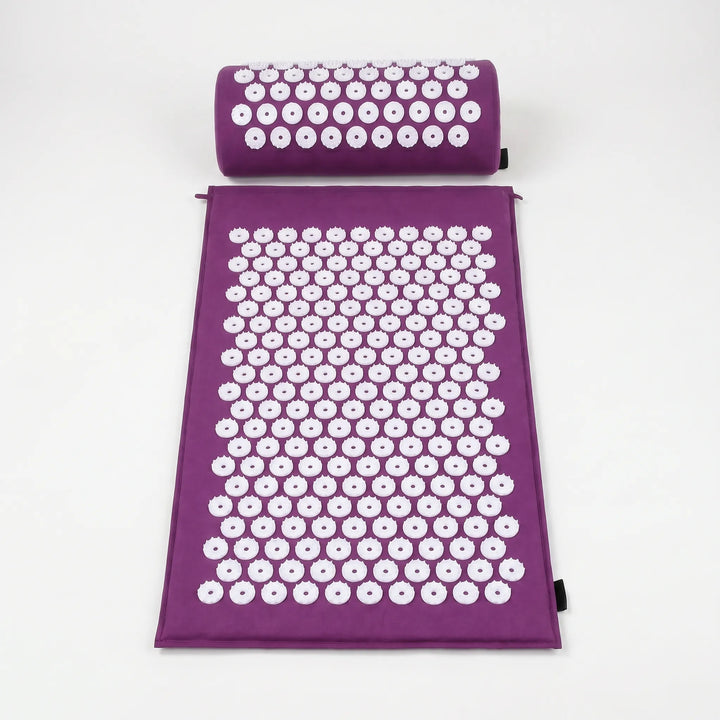 Gray/purple acupressure mat and pillow for targeted pain relief, promoting deep muscle relaxation & well-being.