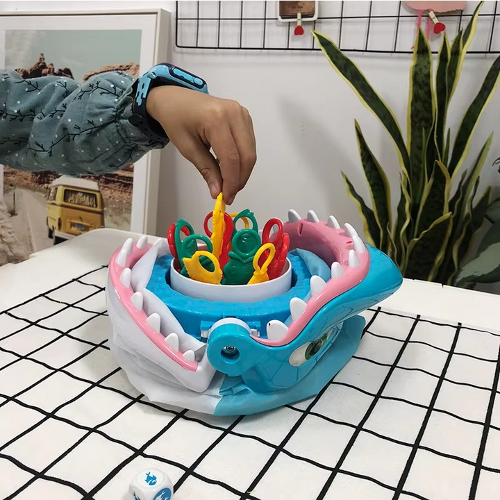 Kids playing the Great White Shark Prank Game, laughing at the biting shark, a fun interactive family party game.